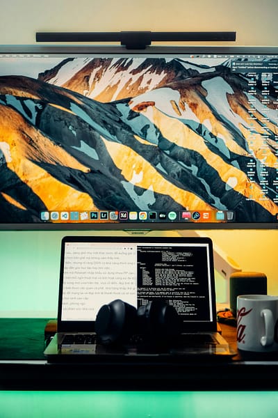 a laptop computer sitting on top of a desk remote desktop session windows on mac screen 2.jpg