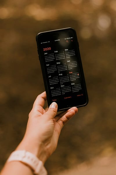 person holding black android smartphone iphone print queue iphone printing airprint interface.jpg