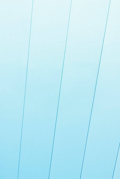 a man riding a snowboard on top of a snow covered slope header image website style background picture.jpg