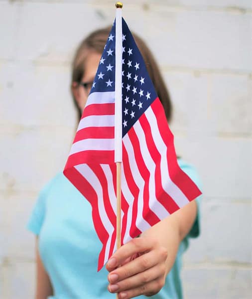 person holding usa flag wordpress free portfolio theme selection.jpg