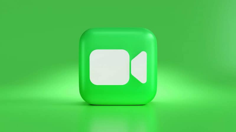 a green square button with a white speech bubble inshot app mobile editing video transitions.jpg