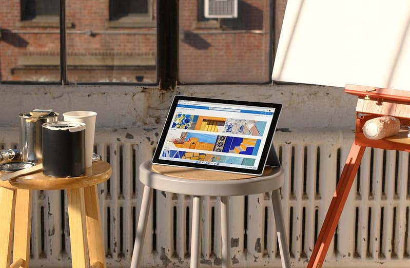 a laptop computer sitting on top of a wooden table hosting plans comparison website performance entrepreneur on laptop cloud computing diagram.jpg