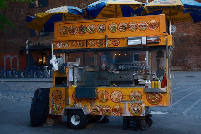 a food cart is parked on the side of the road retro food truck vintage design diner style.jpg