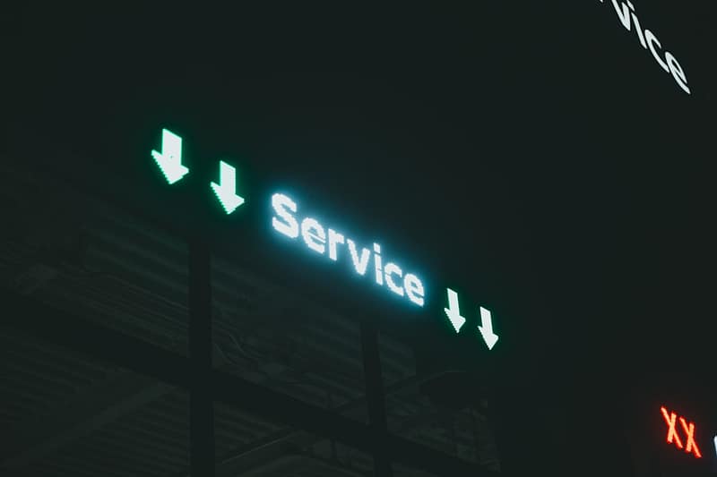a lit up sign that says service i and x discord server ownership transfer settings user list 1.jpg