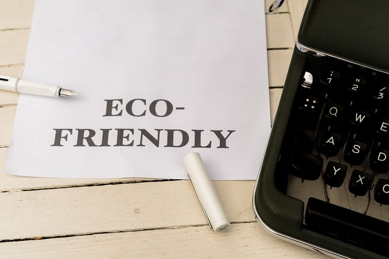 a piece of paper that says eco friendly next to a typewriter eco products newsletter kitchen sustainability headline.jpg