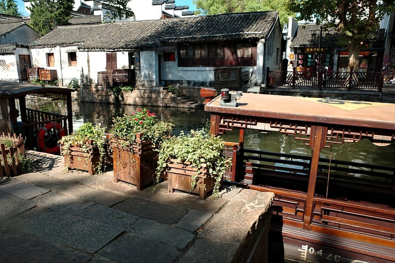 traditional chinese canal town with boats and buildings local sellers used furniture community marketplace.jpg
