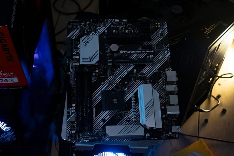 a computer motherboard sits on a surface asus rog strix motherboard lan port.jpg