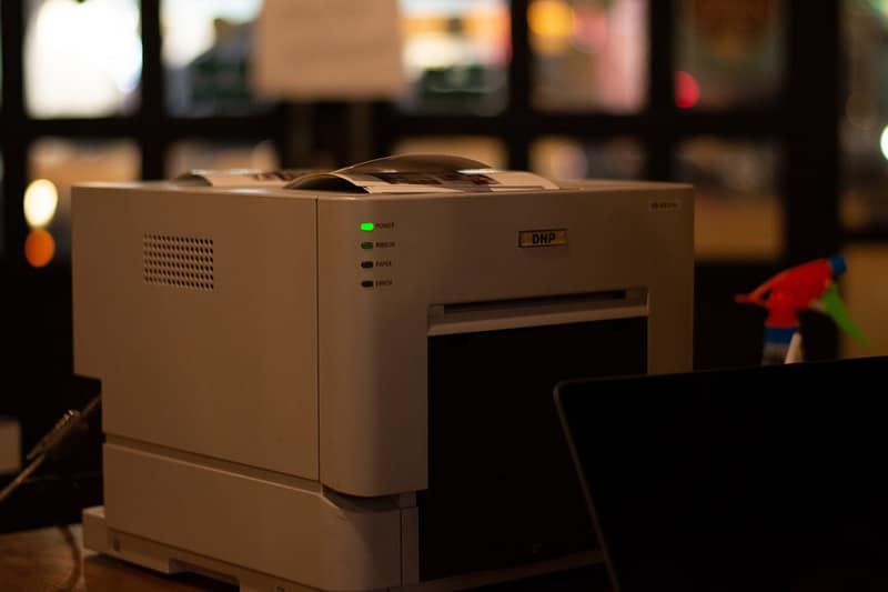 a white printer on a table printer wireless modern desk.jpg