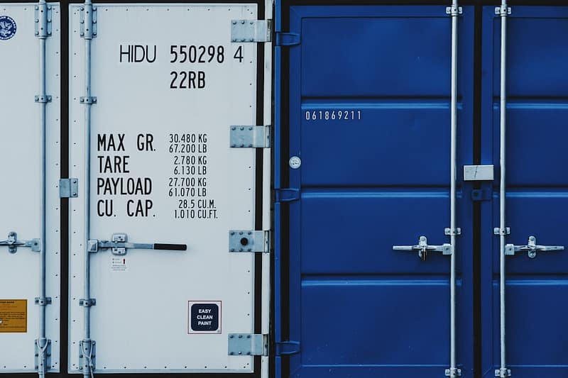 a couple of blue and white shipping containers h264 mp4 comparison diagram file types video container codec.jpg