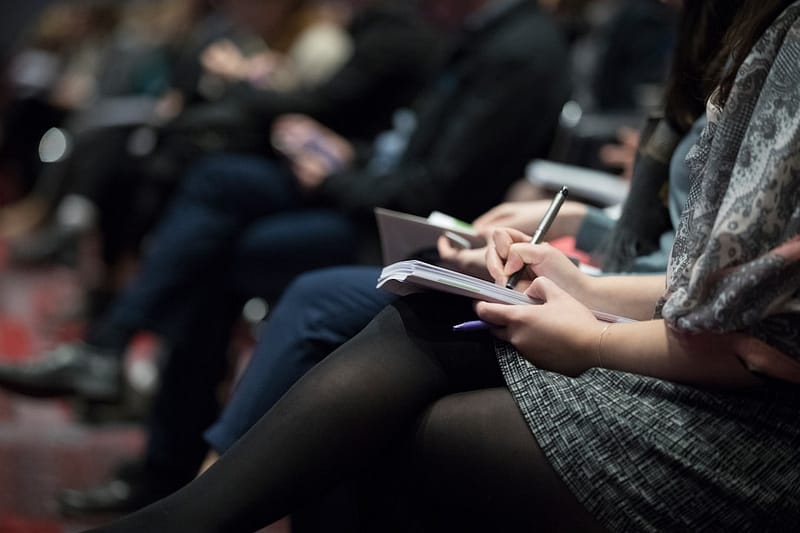 selective focus photography of people sitting on chairs while writing on notebooks virtual meeting creative team online collaboration.jpg
